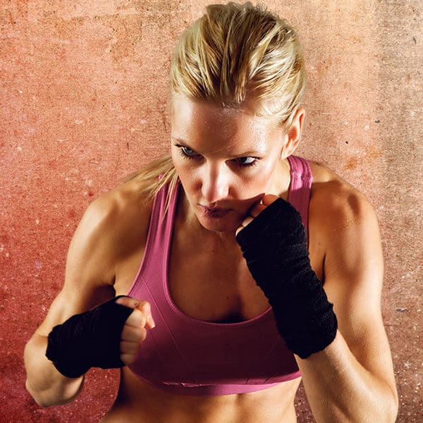 Mixed Martial Arts Lessons for Adults in Brampton ON - Lady Kickboxing Focused Background